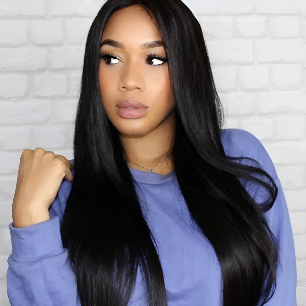 Long straight black synthetic wig with centre part and bangs on a mannequin head
