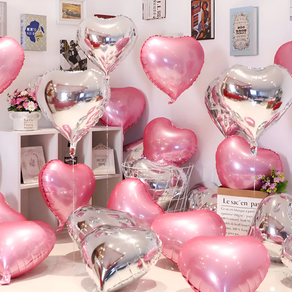 Five aluminium foil peach heart balloons in metallic colours arranged together