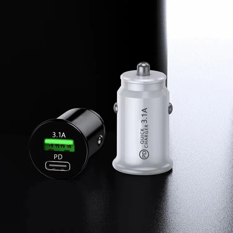 Black dual USB car charger plugged into vehicle 12V socket with phone charging