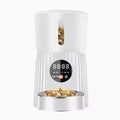 Intelligent automatic pet feeder with timer display and food reservoir in black or white colour options
