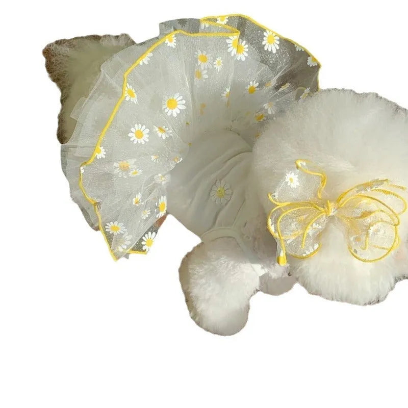 Yellow daisy pattern thin polyester dog clothes on a pet, showing summer apparel fit.