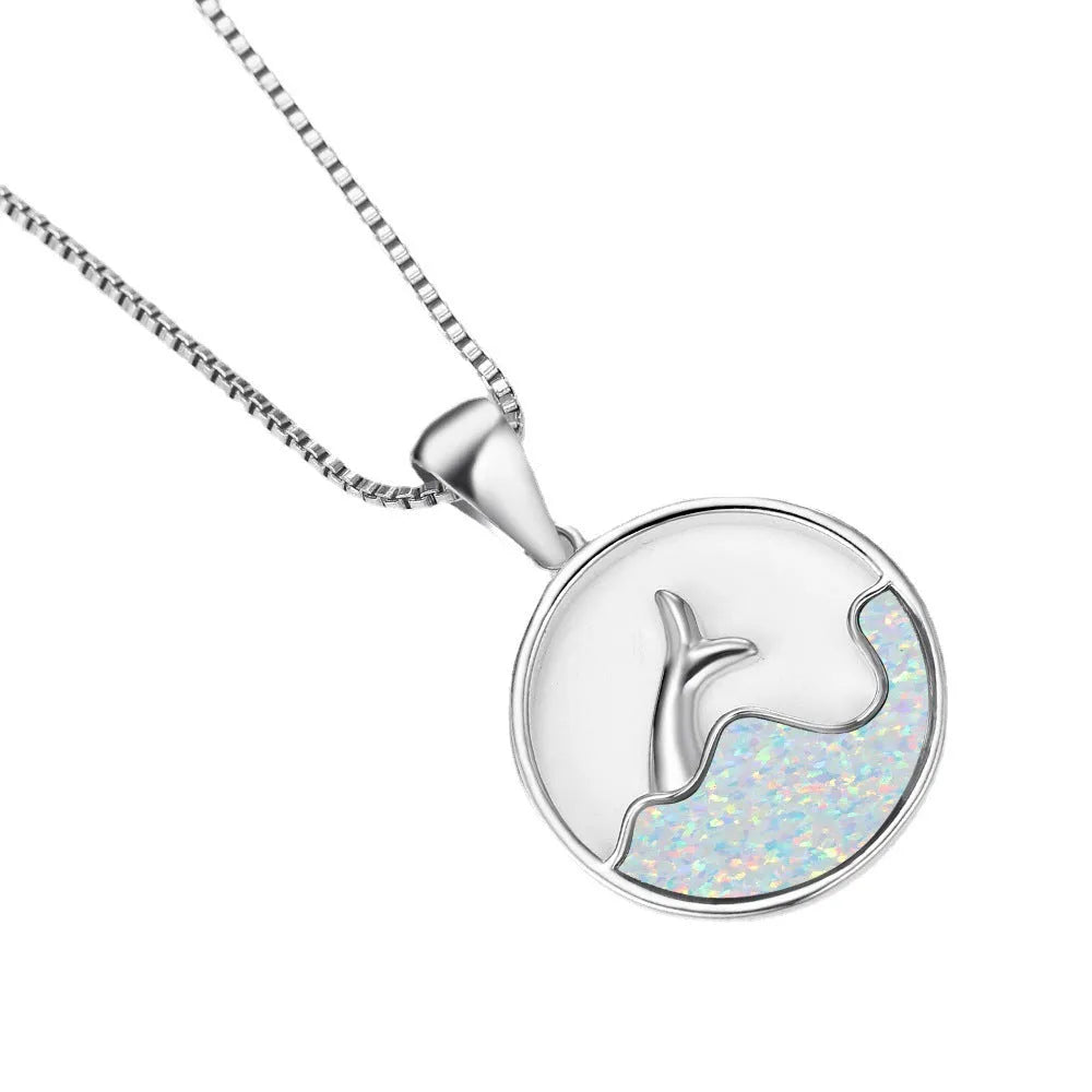 Geometric fishtail pendant necklace with electroplated white gold finish and round decorative elements