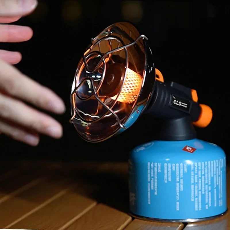 Black and orange portable outdoor heating stove with automatic press ignition for camping