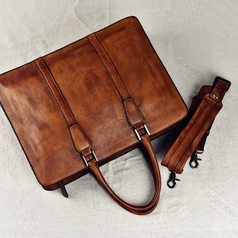 Men's brown leather business handbag with horizontal square shape and zipper closure