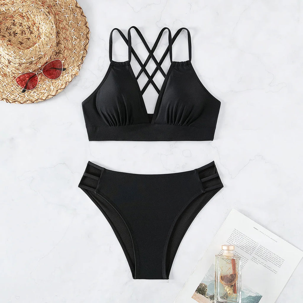 Women's black V-neck halter bikini set with removable pads on a mannequin