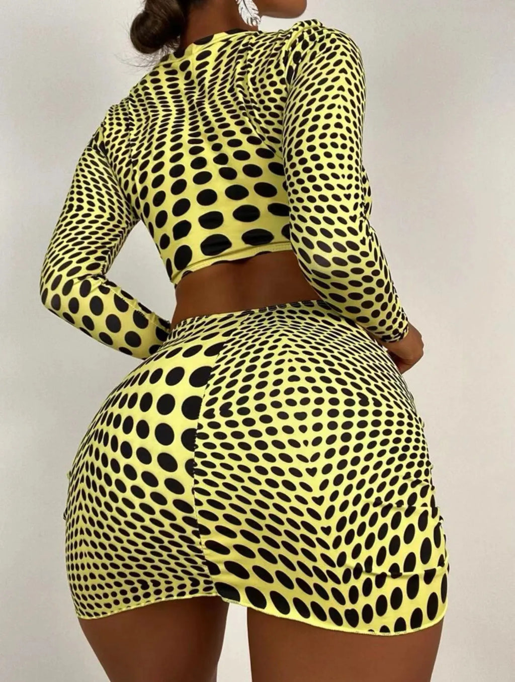 Green polka dot women's three-piece swimsuit set showing bikini top, skirt, and bra.