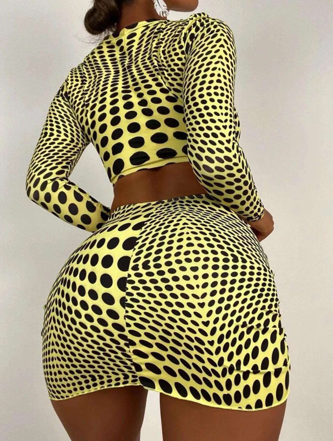 Green polka dot women's three-piece swimsuit set showing bikini top, skirt, and bra.