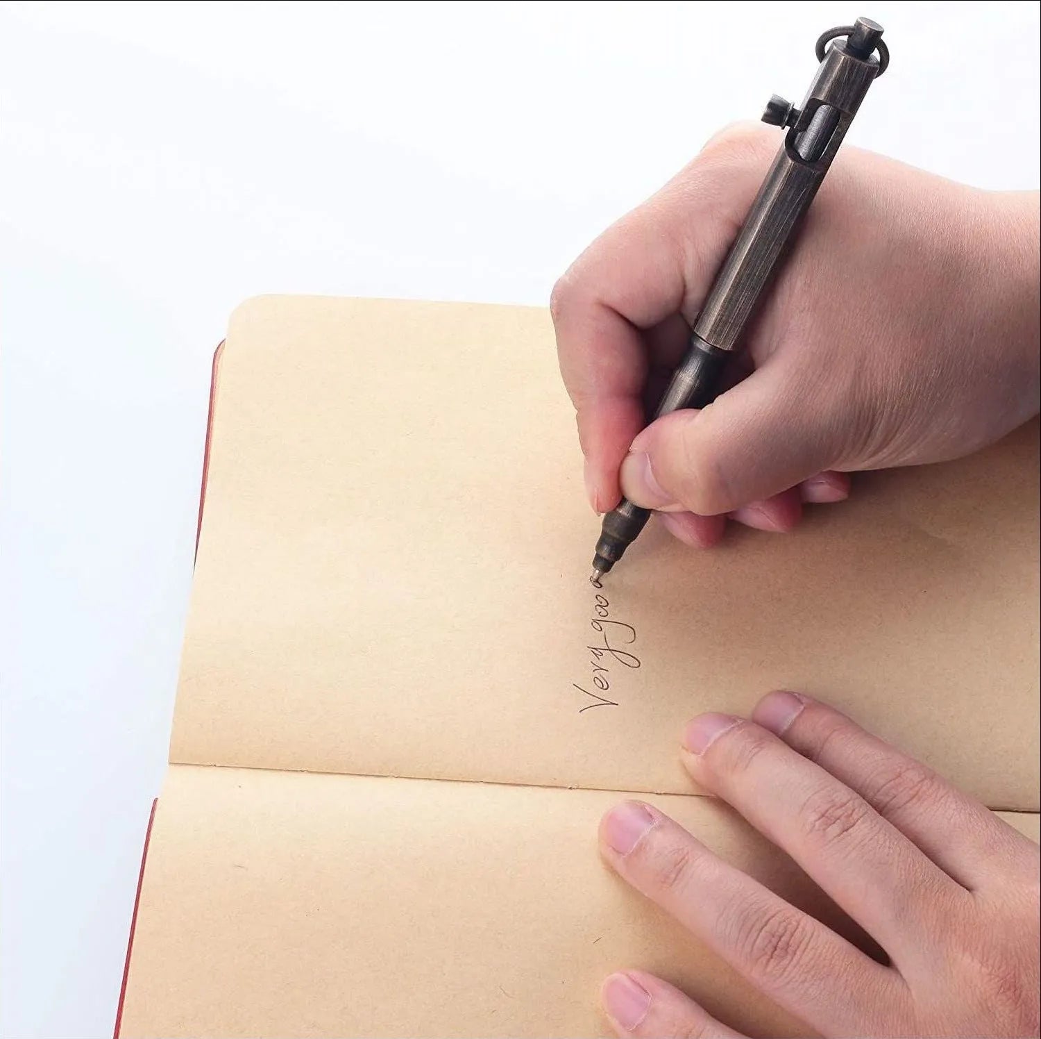 Brass hexagonal tactical pen in natural brass and retro black colours on a black gift box.