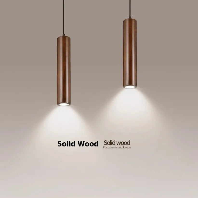 Solid wood Japanese style long chandelier with three warm light droplights in a modern bedroom