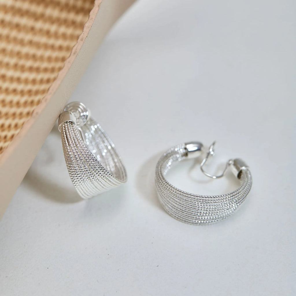 Geometric multi-layer earrings with electroplated gold or silver finish and clip or stud backings