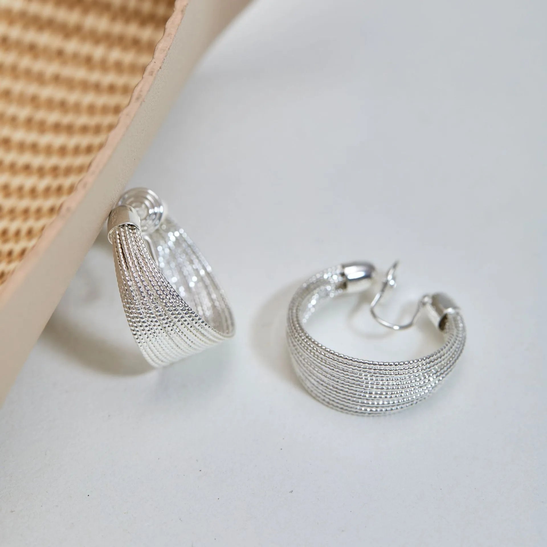Geometric multi-layer earrings with electroplated gold or silver finish and clip or stud backings