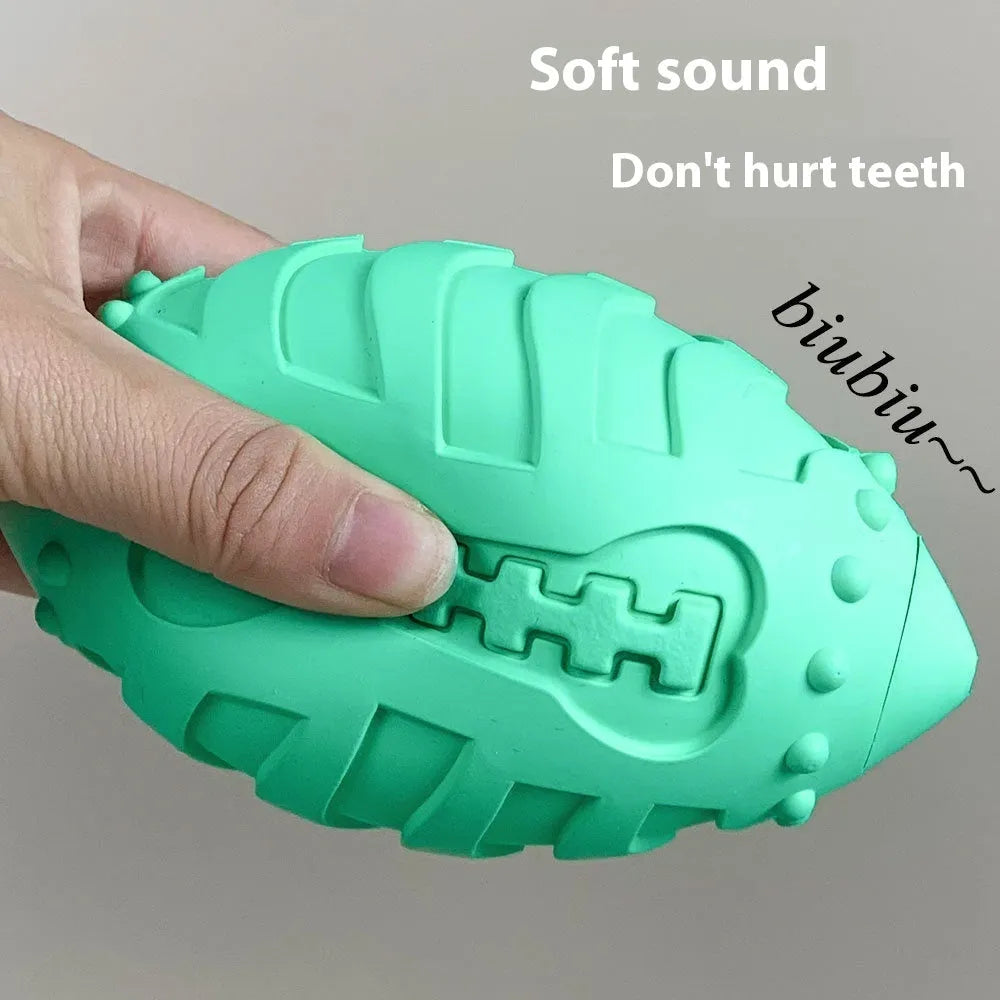 Light green thickened rubber rugby ball dog toy with textured surface for teeth cleaning.
