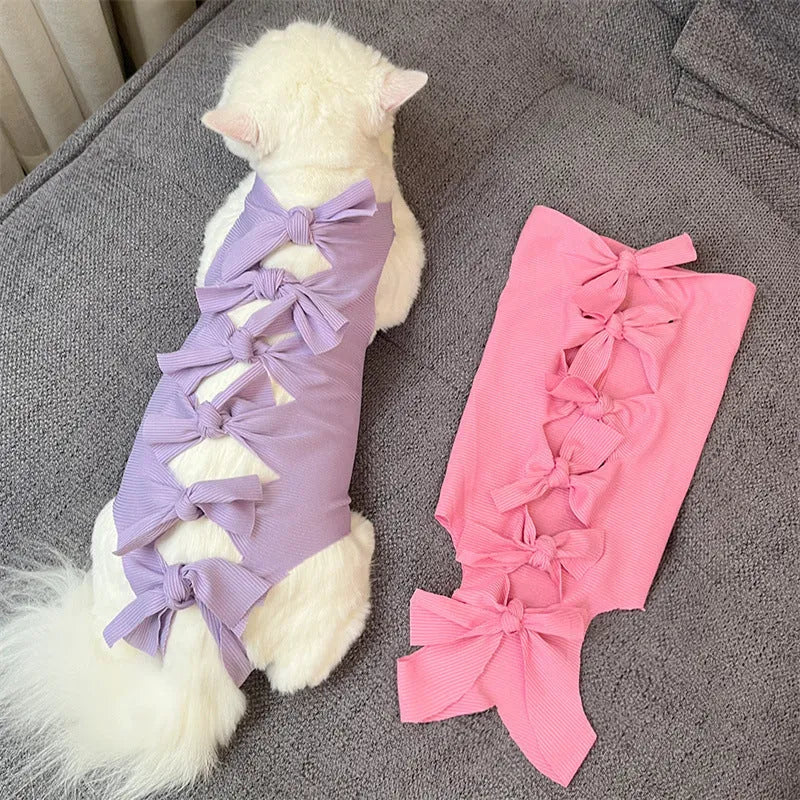 Lace-up polyester recovery clothing for cats after sterilisation, shown in multiple colours and sizes.