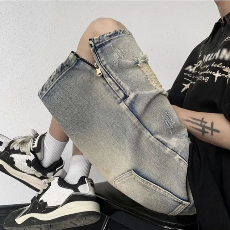 Blue retro denim shorts with a wide-leg loose fit and tattered detailing on a mannequin.