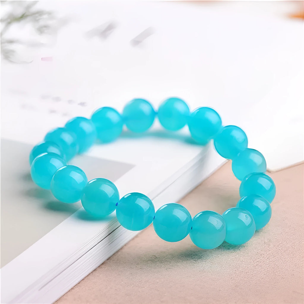 Grade 7A Amazonite natural stone scattered beads in ice colours for bracelet making, shown with a finished crystal bracelet.
