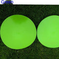 Yellow soft TPE football training target disc lying flat on grass