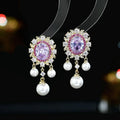 Oval geometric copper earrings with zircon inlay and pearl tassels in light purple colour