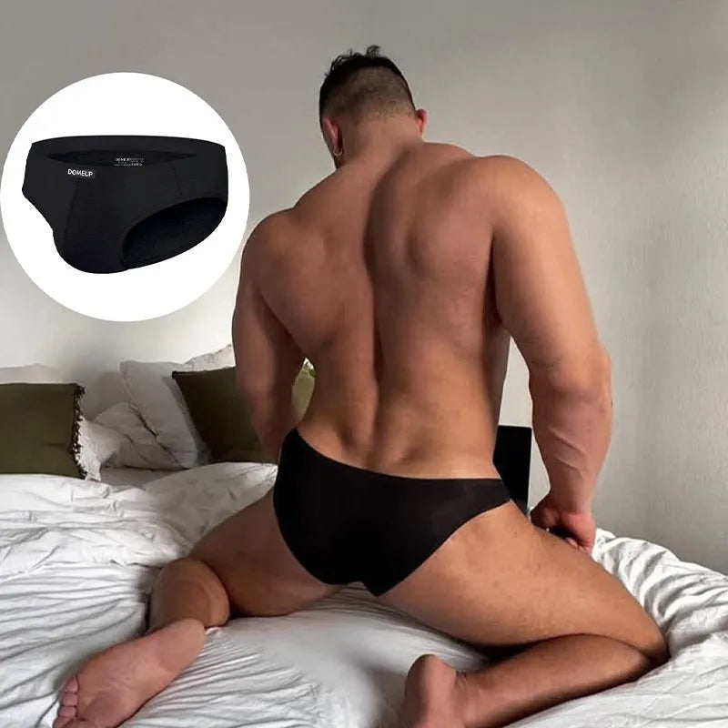 Men's solid colour breathable briefs with seamless low-waist construction in white, black, and pink colours