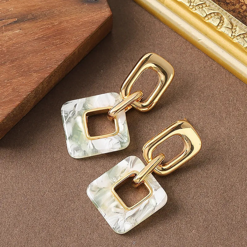 Geometric hollow square earrings with chamfered corners in electroplated copper