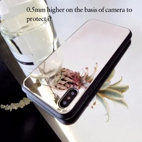 Black iPhone mirror phone case showing reflective surface on back, compatible with iPhone X and other models.