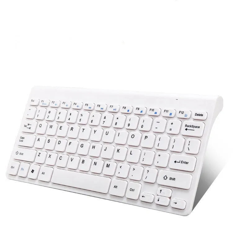 Black wireless keyboard and mouse set on wooden desk showing 2.4GHz wireless operation