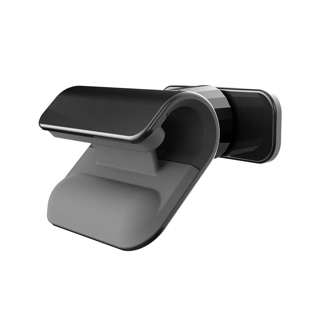Black gravity car phone holder with adhesive mount, showing 360-degree rotation mechanism.
