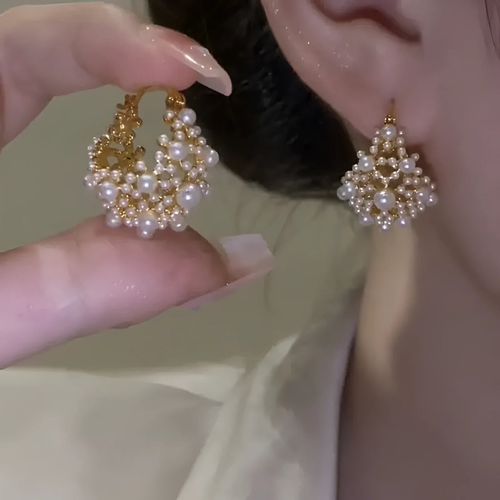 Gold-coloured copper flower basket earrings for women with small bead detailing and pearl inlay.