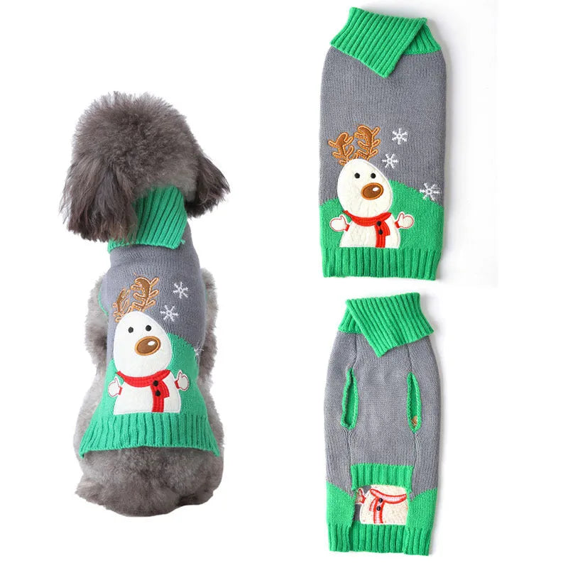Small dog wearing a grey acrylic Christmas sweater with a red pompom detail