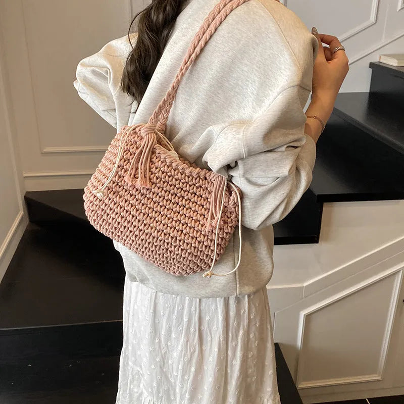 Knitted bucket shoulder bag in beige with external sandwich pocket and sewing thread detail for women