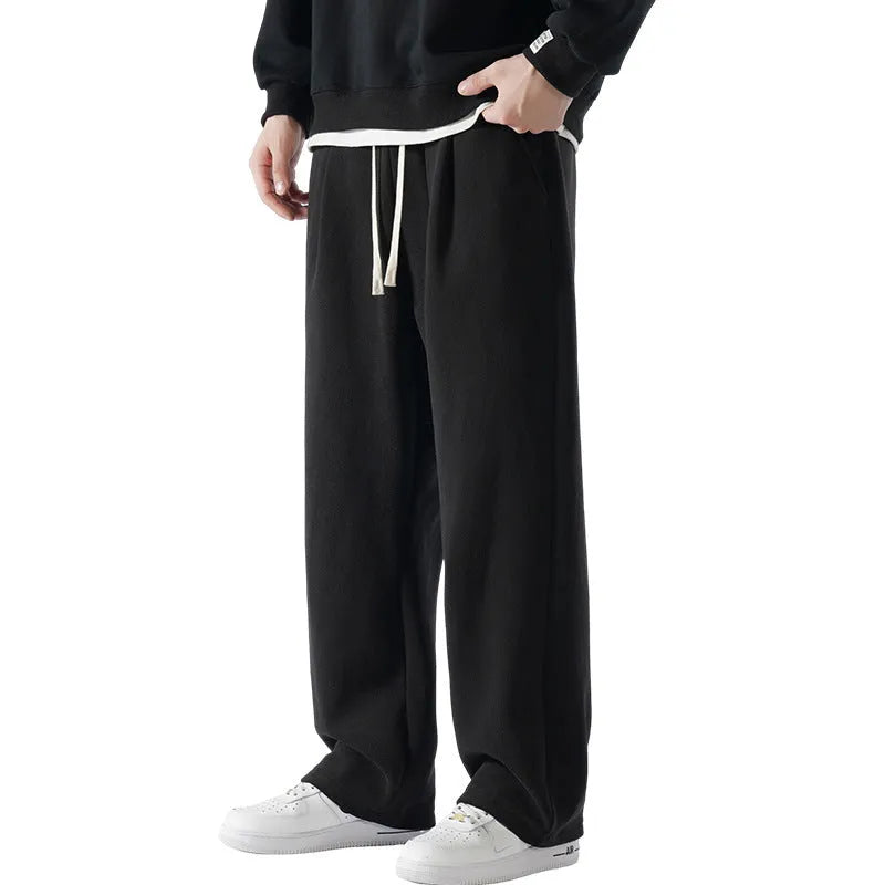 Men's apricot coloured loose-fit polar fleece trousers with a thick lining and drawstring waist.
