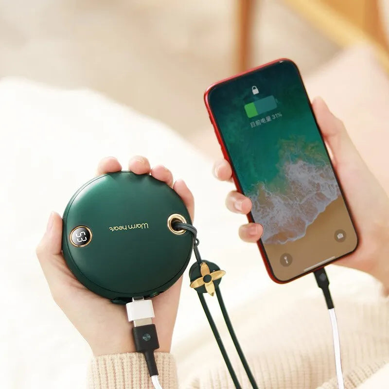 Green hand warmer power bank with digital display showing battery percentage, USB Type-C cable included