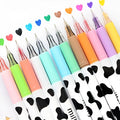 Box of twelve cow pattern gel pens with 0.38mm tips in assorted colours.