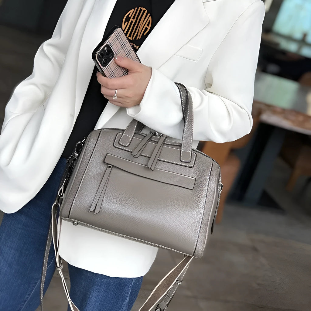 Soft genuine leather shoulder messenger bag with Boston lychee pattern and internal organiser pockets.