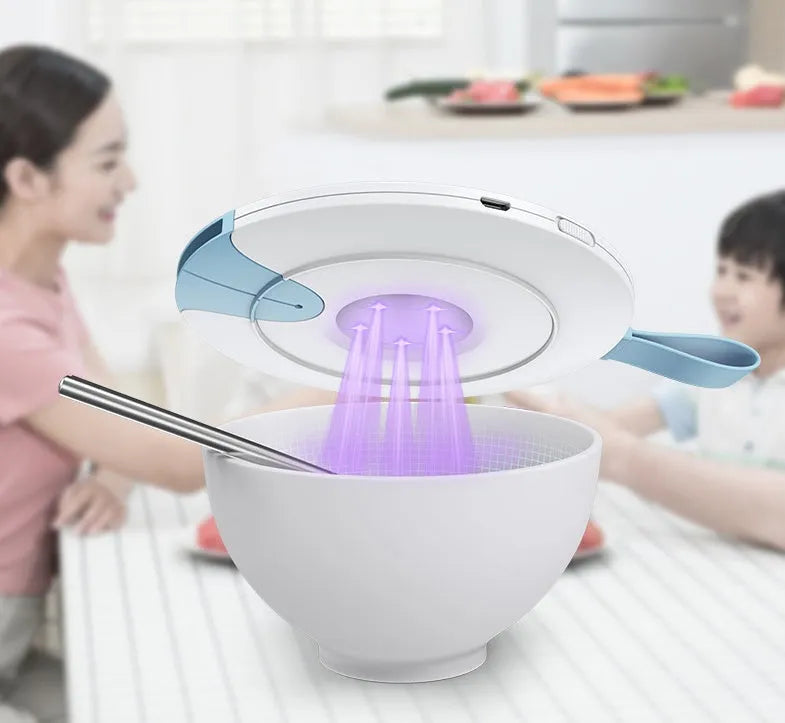 Portable blue UV baby bottle steriliser unit showing compact size and USB charging port.