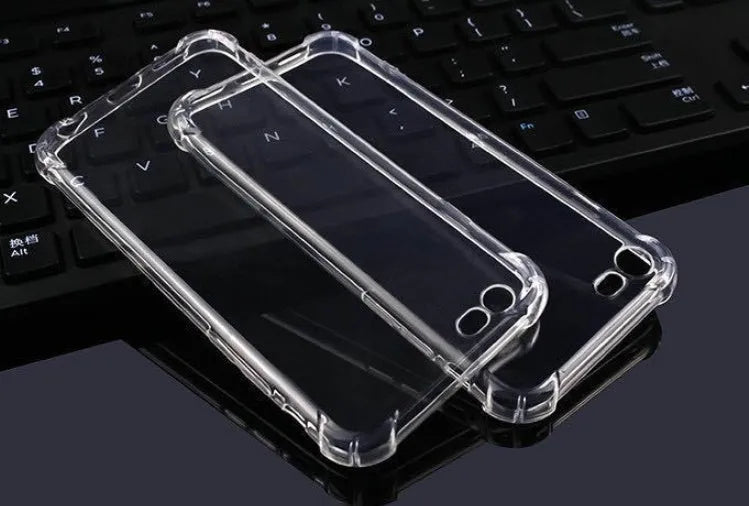 Transparent TPU shockproof phone case for various iPhone models on a table.