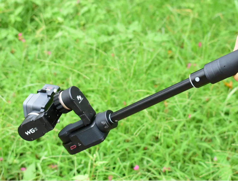 Black retractable extended selfie stick with smartphone clamp and adjustable tripod base