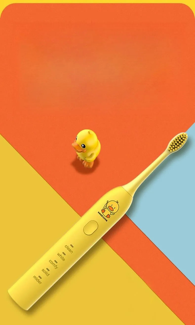 Yellow rechargeable electric toothbrush with small duck design, soft bristles, and a compact size.