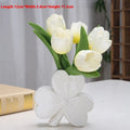 A white porcelain ceramic vase in European style for desktop decoration.