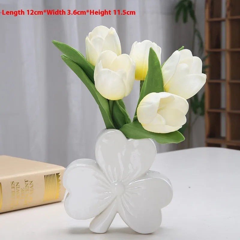 A white porcelain ceramic vase in European style for desktop decoration.
