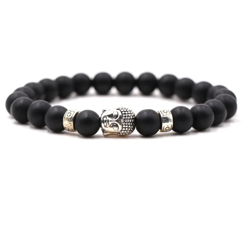 Natural stone stretch bracelet with round 8mm beads including tigereye and turquoise on a black background.