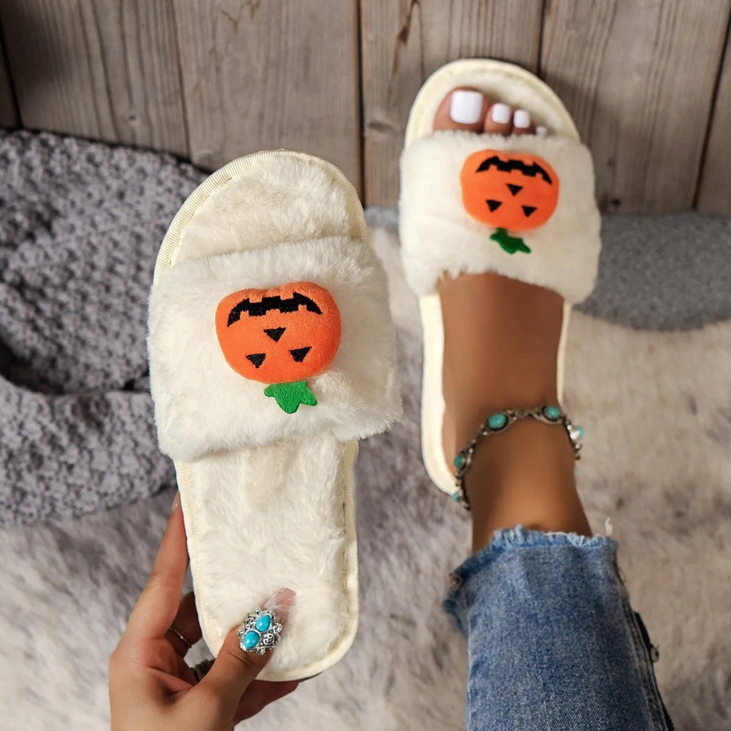Halloween pumpkin plush slippers with open toe design in yellow colour showing synthetic fur and anti-slip soles