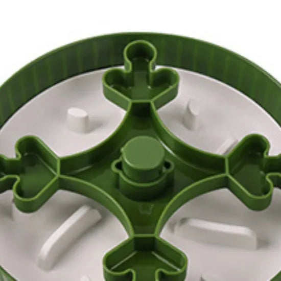 Interactive pet slow feeder bowl with a rotating design and a central, removable silicone licking mat.