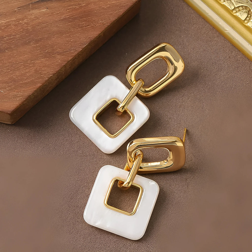 Geometric hollow square earrings with chamfered corners in electroplated copper