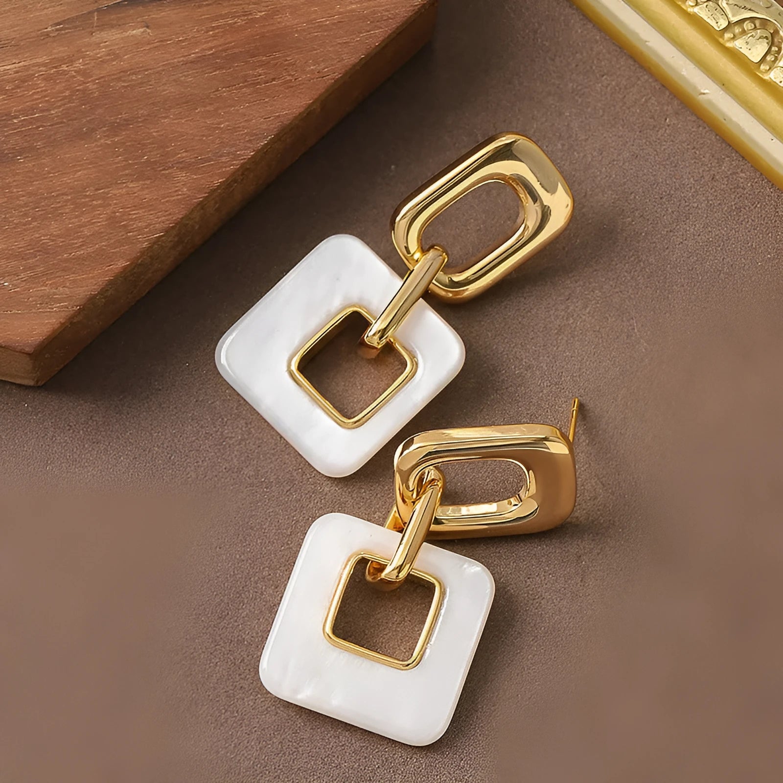 Geometric hollow square earrings with chamfered corners in electroplated copper