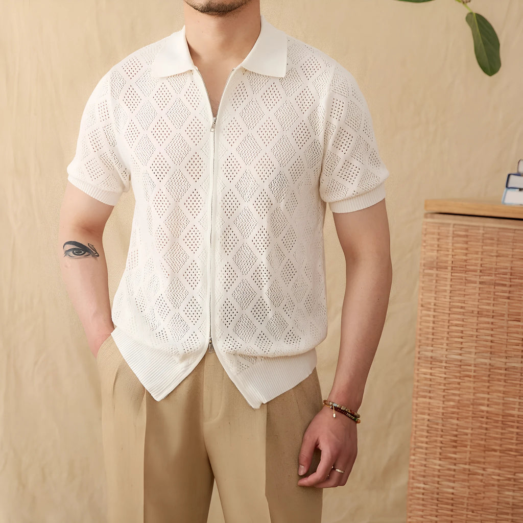Men's light brown short sleeve cotton cardigan with zip front and lapel collar laid flat.