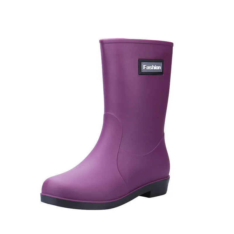 Women's PVC rain boots in black with mid-calf height and low heel design