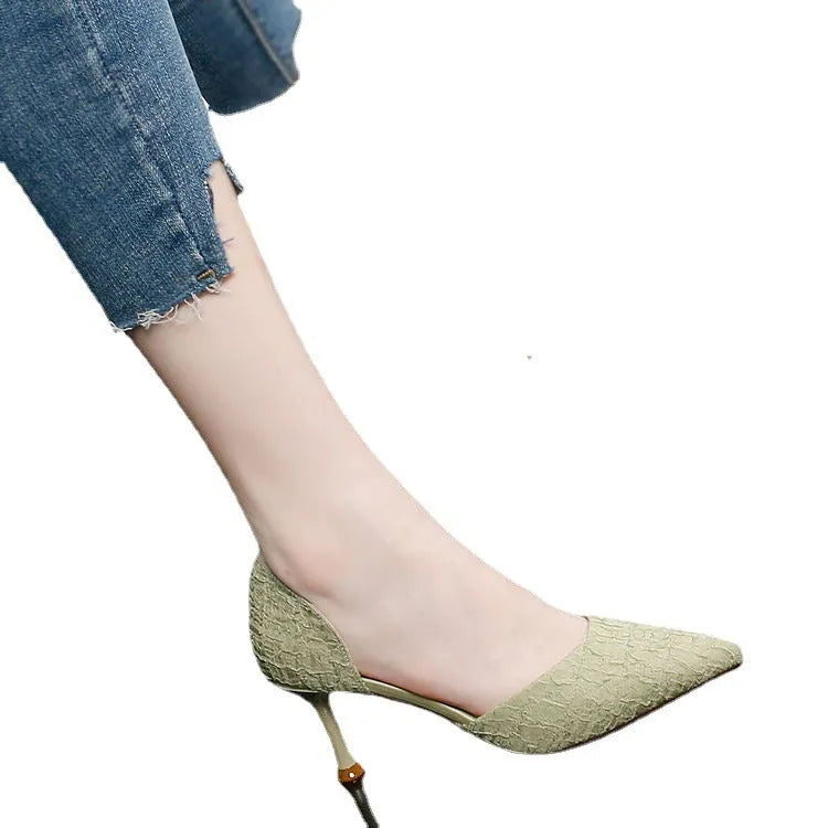 Women's black pointed-toe stiletto high heel pump with PU leather upper on a white background.