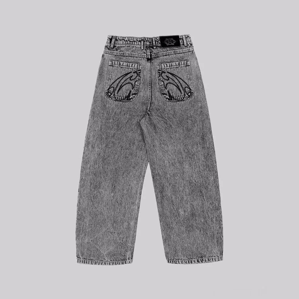 Grey loose straight-leg denim trousers showing mid-waist design on mannequin