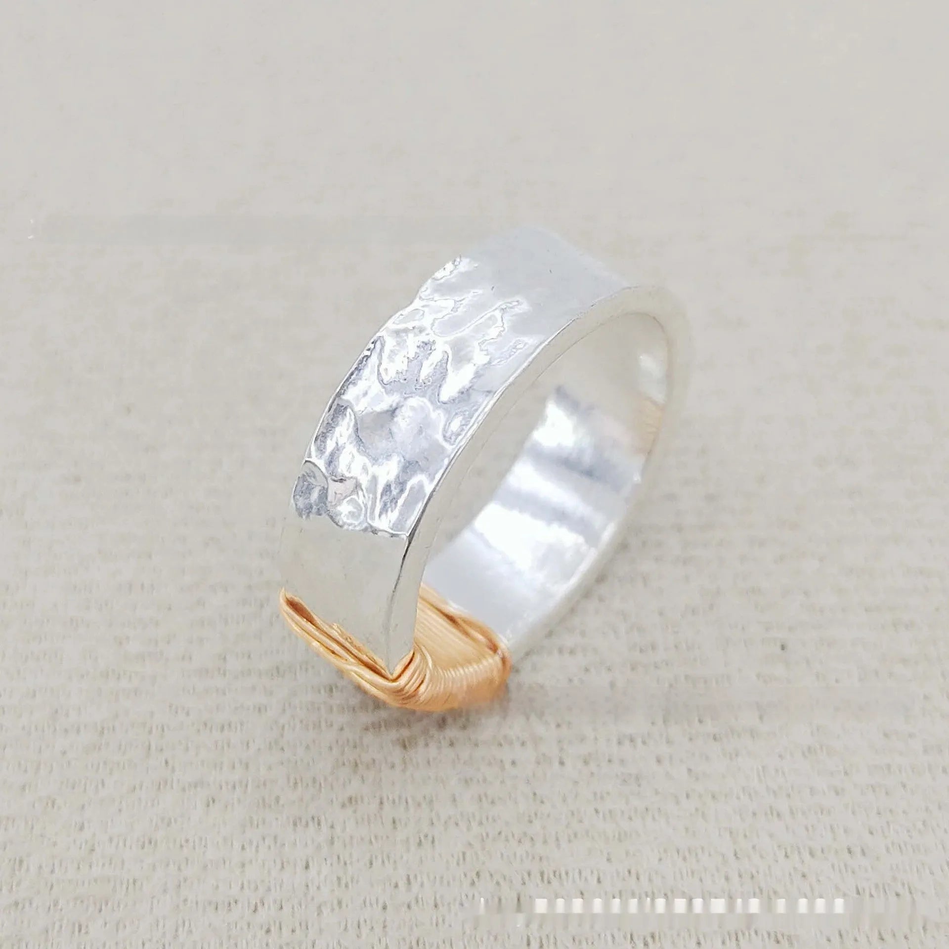 Copper geometric simple bracelet with silver gold coil finish and wide ring design.