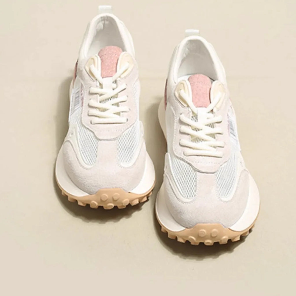 Women's pink and grey retro low-top sneaker with round toe and flat rubber sole.